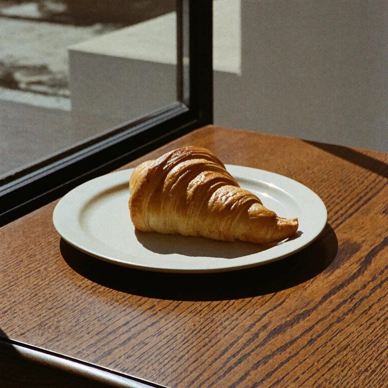A croissant on a small plate